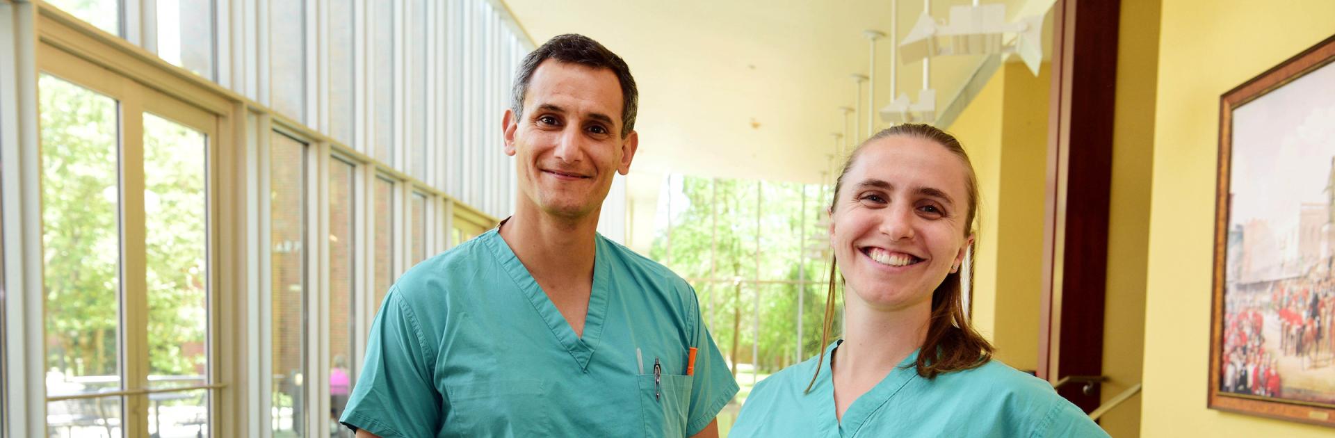 two students in scrubs