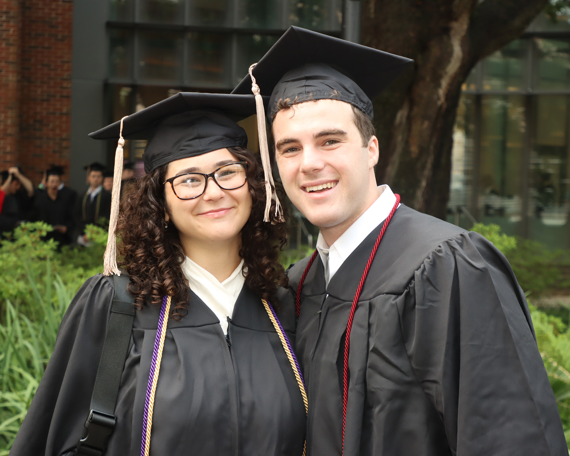 students posing for a photo during commencement 2024