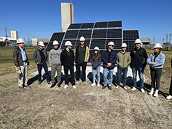 Students in front of solar panels