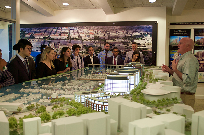 Students view a real estate model