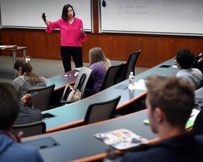 Professor teaches an MBA class at Freeman Business School