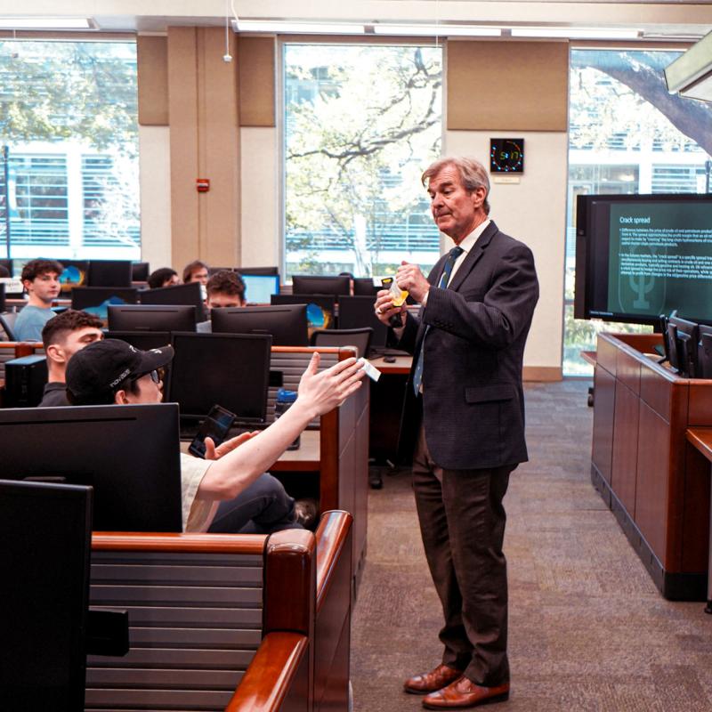 Freeman faculty member Pierre Conner answering questions during a lecture in the GWBC Trading Center.