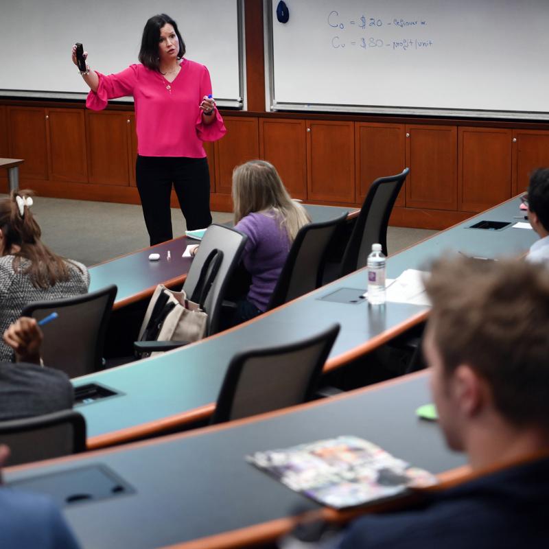 Professor teaches an MBA class at Freeman Business School