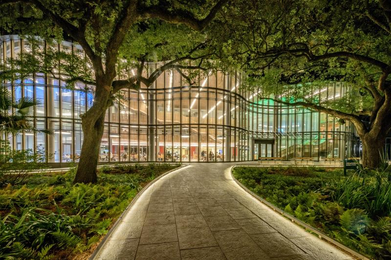 exterior of the Goldring/Woldenberg Business Complex at dusk in 2018.