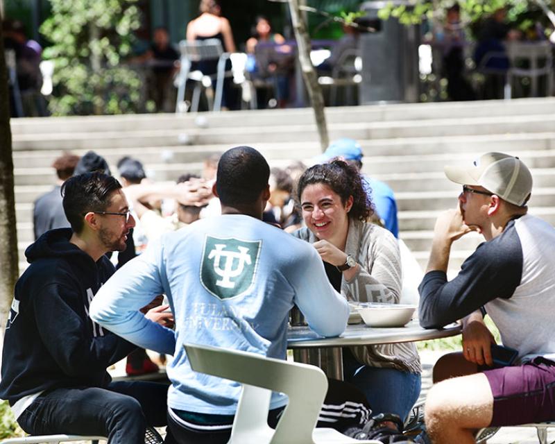photo of students seated outside in a GWBC court yard