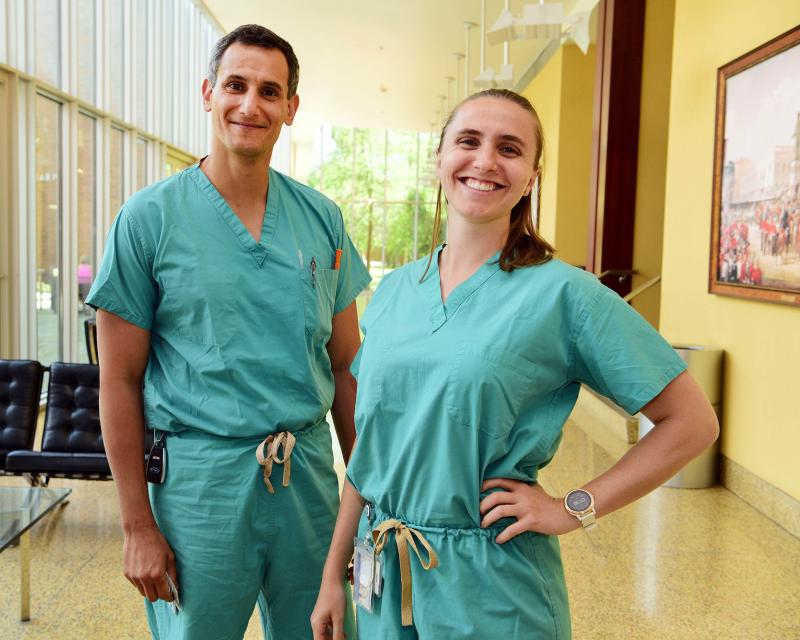 Freeman dual MBA/MD graduate students posing in their scrubs between classes.