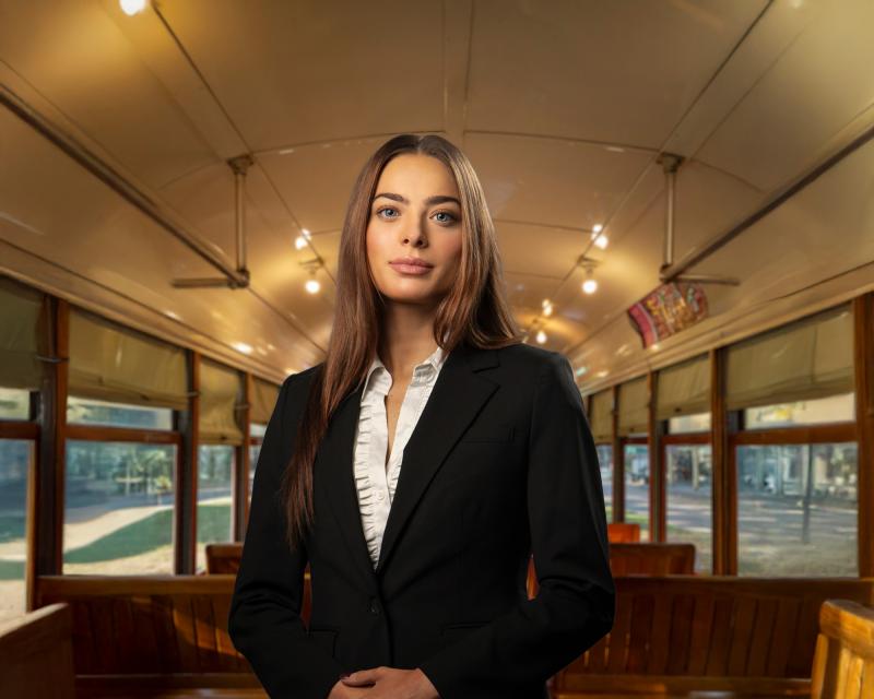 Freeman student Isbella standing in a New Orleans street car.