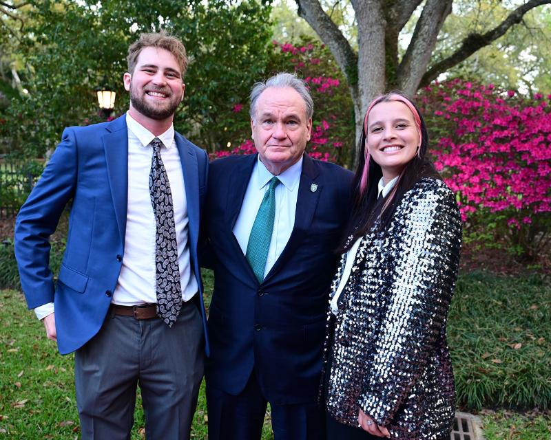 Tulane University President Michael Fitts with the 2026 Distinguished Entrepreneurs of the Year, Franziska Trautmann (SSE ’20) and Max Steitz (SLA ’20).
