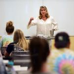 photo of Sanda Groome instructing a classroom