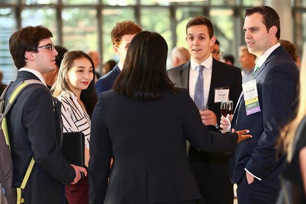 Students and faculty having a discussion at a Freeman 50 event