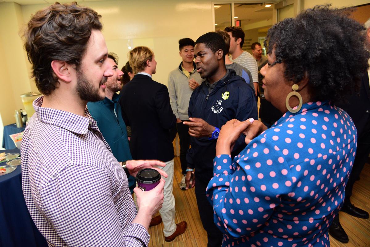 A student pitches their business idea to Tulane faculty.